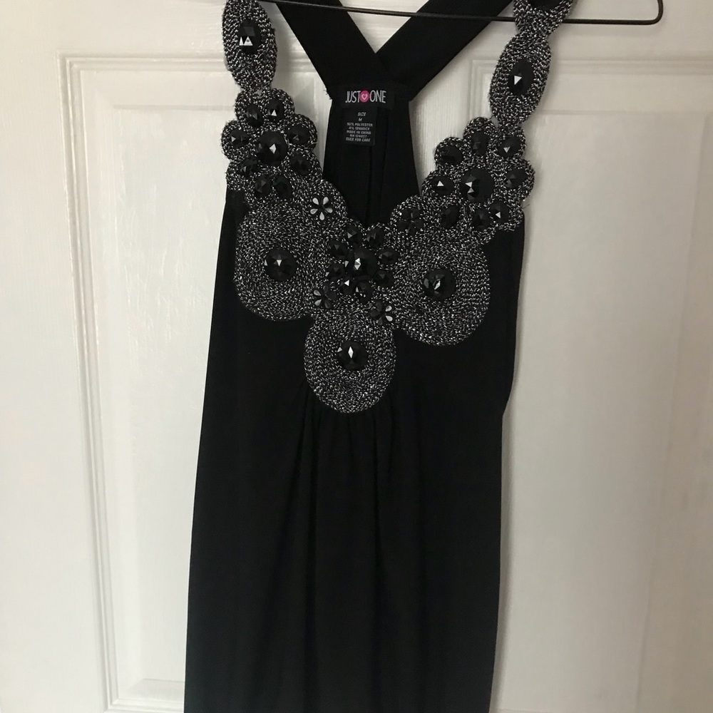 Black top with embellishments.